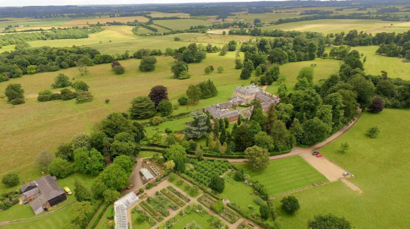 Aerial photo of Belmont House, a large, imposing residence with extensive grounds.