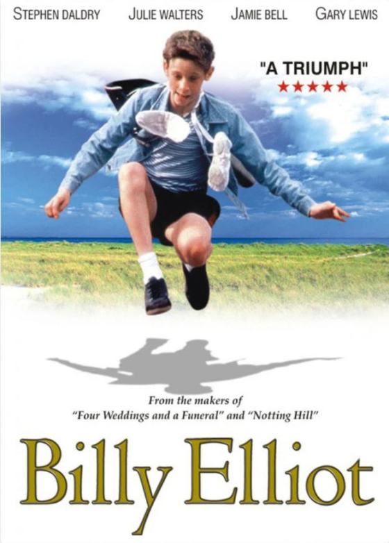 Movie poster for the film "Billy Elliot" shows a boy doing a jumping dance move in his dancing shoes with his tennis shoes tied by the laces around his neck.